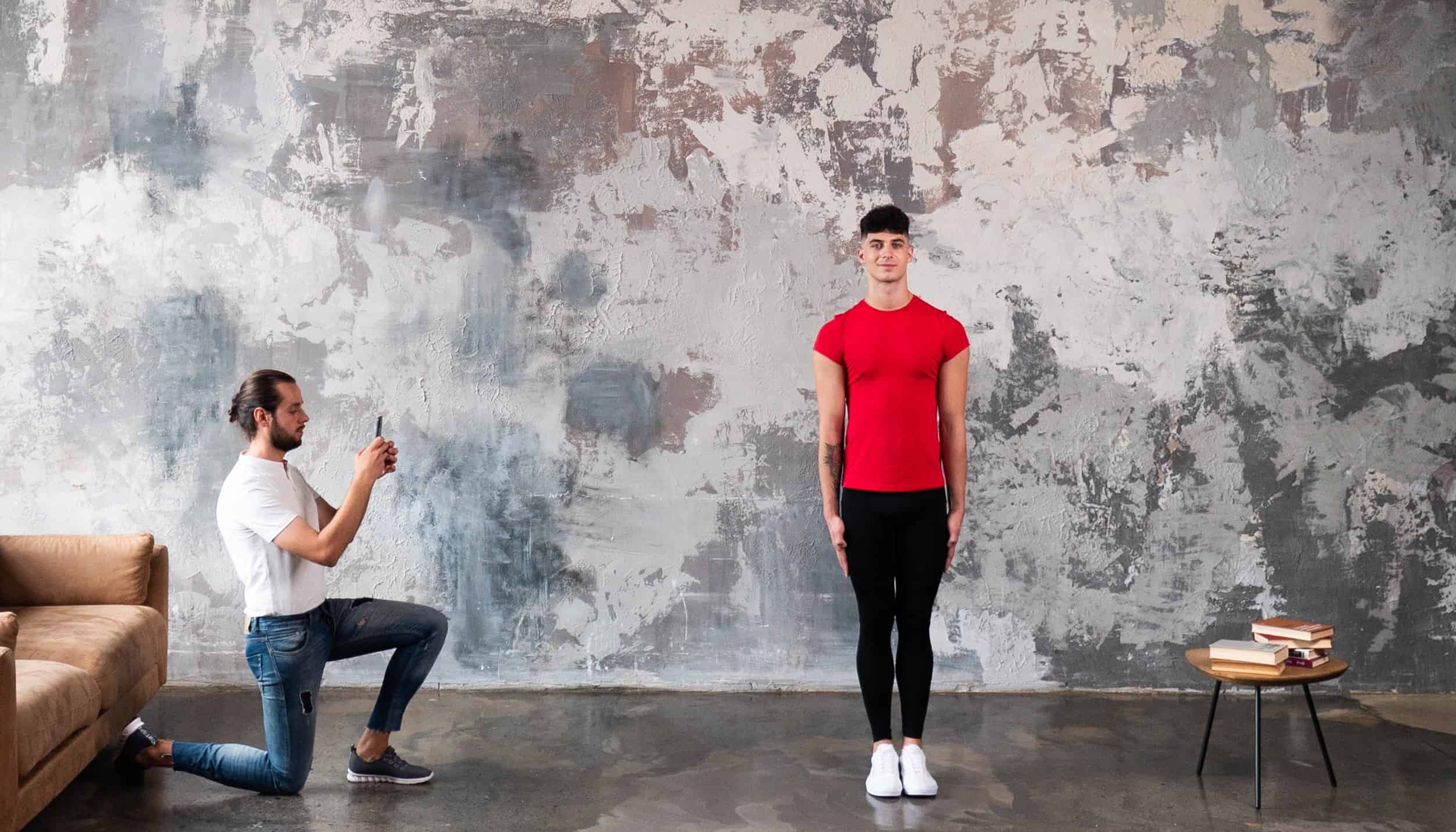 The Ultimate Guide to taking photos in a living room features a man posing with a woman.