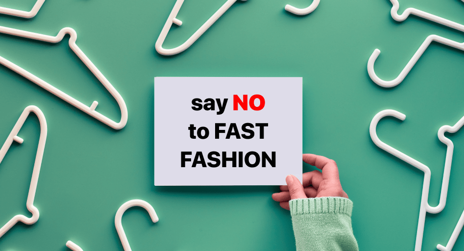 A person holding up a sign that says "say no to fast fashion.