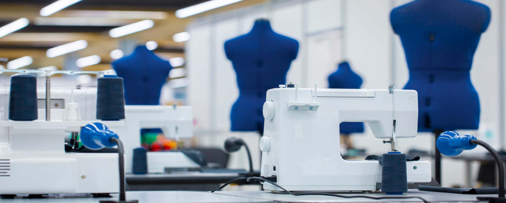 A factory equipped with sewing machines and mannequins for the uniform manufacturing process.