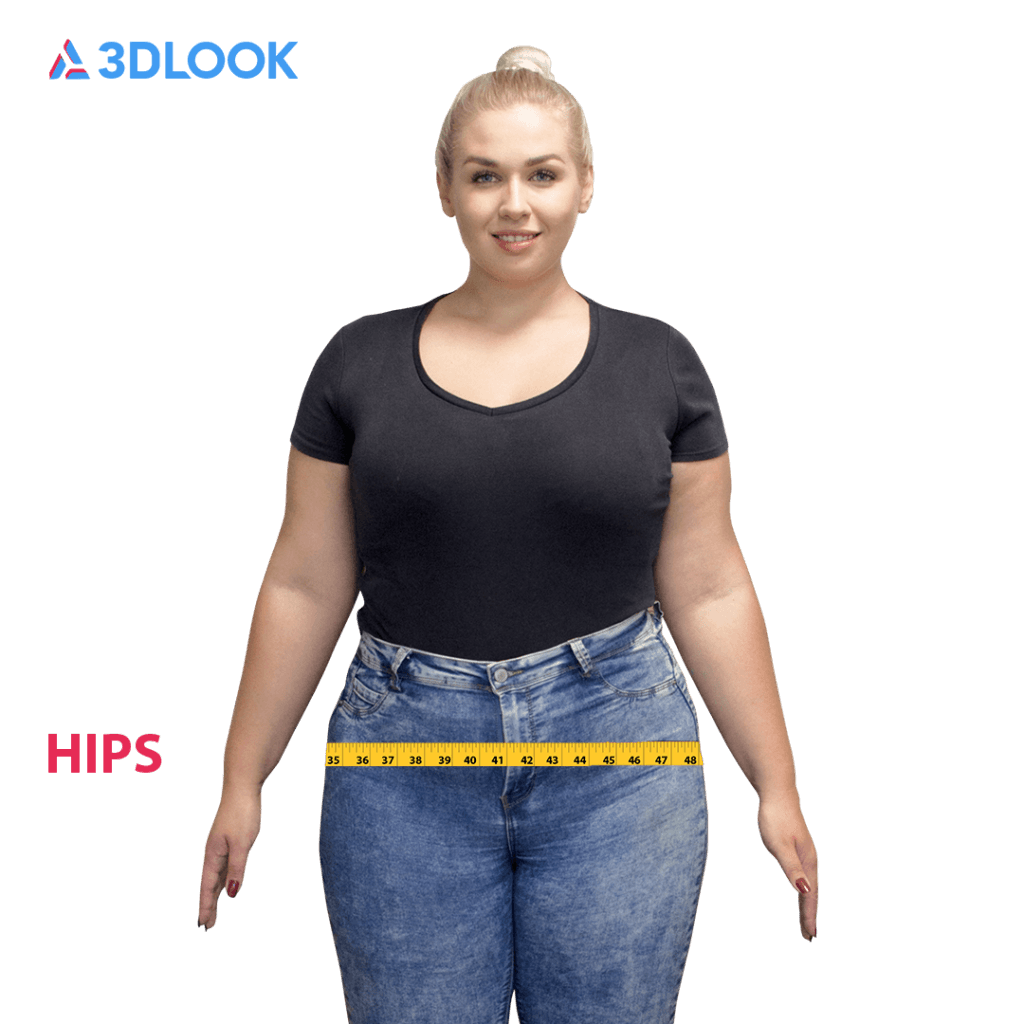 A woman stands facing forward wearing a black t-shirt and jeans, with a yellow measuring tape wrapped around her hips. The image includes text: 