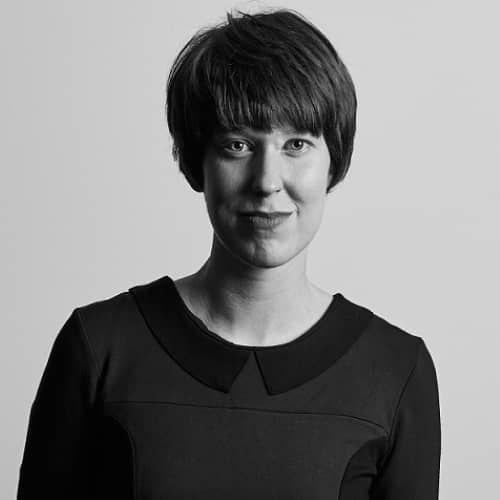 A black and white photo of a woman with short hair, ranked in the TOP 50 influencers.