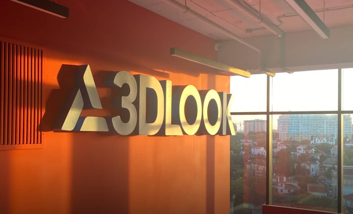 A 3D logo in a modern office building, representing employment opportunities.