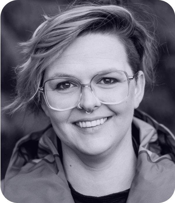 A black and white photo of a woman wearing glasses captured by AI technology.