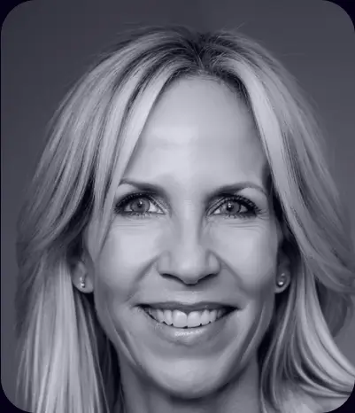 A black and white photo of a woman smiling, enhanced with AI technology.