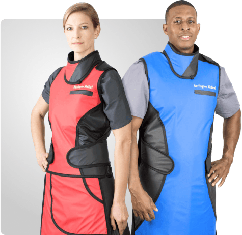 Two healthcare professionals wearing lead aprons, one red and the other blue, with protective gloves, standing confidently on the homepage.