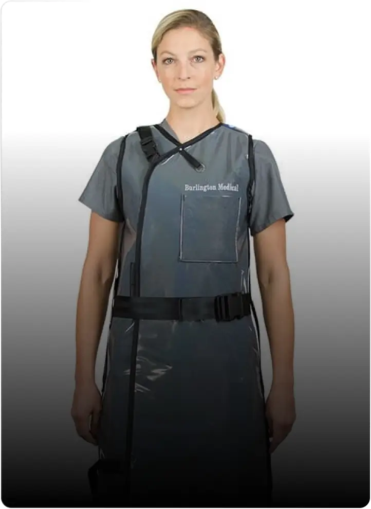 A person wearing a gray Burlington Medical protective apron, tailored impeccably by Mobile Tailor, stands facing the camera.