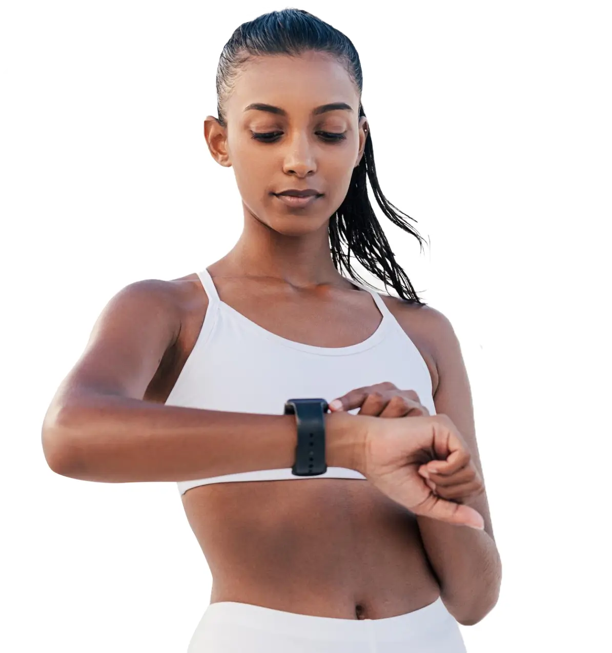 A woman in athletic wear looks at a smartwatch on her wrist, exploring its various use cases for her fitness routine.