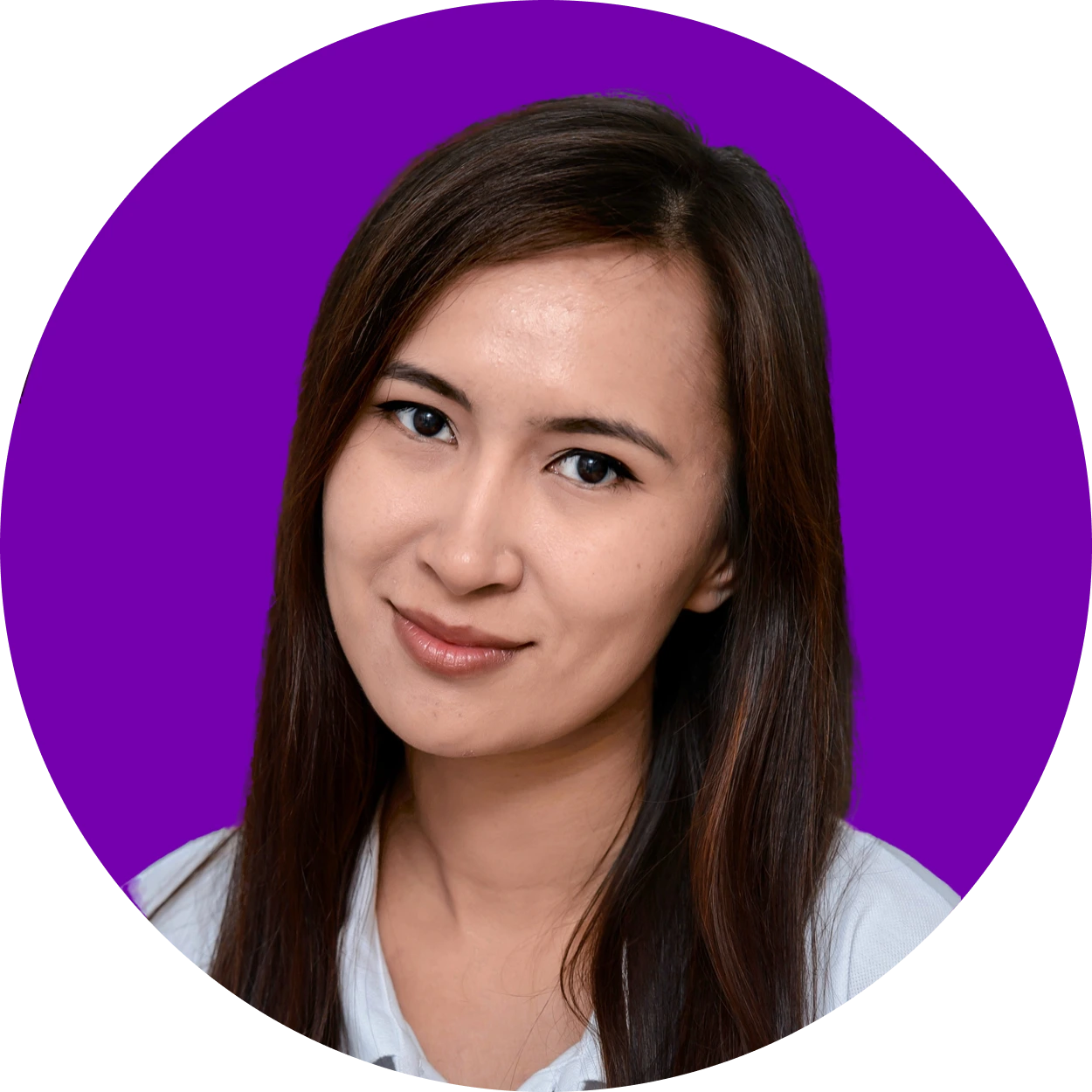 Woman with straight dark hair and a slight smile, wearing a white shirt, posed in front of a solid purple background.